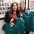 Two incoming D1 students participating holding scrubs on Welcome Day